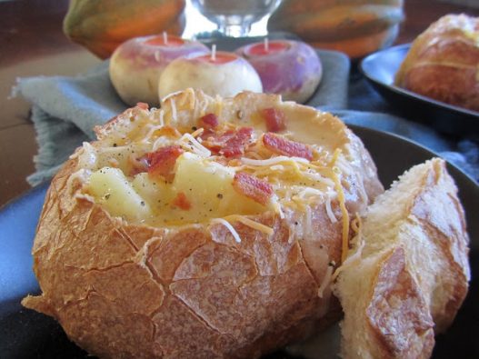 Potato Bacon Cheddar Soup in Sourdough Bread Bowls is a comforting and flavorful cheese soup recipe for fall!