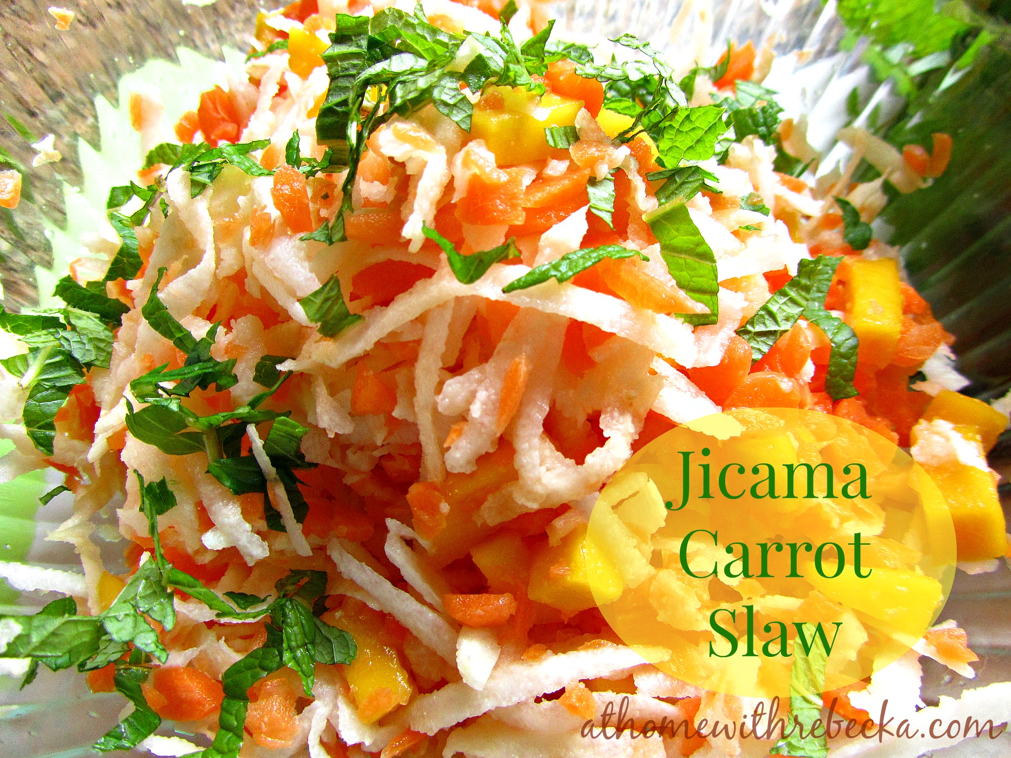 Jicama carrot and mango slaw is full of bright flavor and color! This delicious slaw recipe makes the perfect side dish, or add protein to make a complete meal.