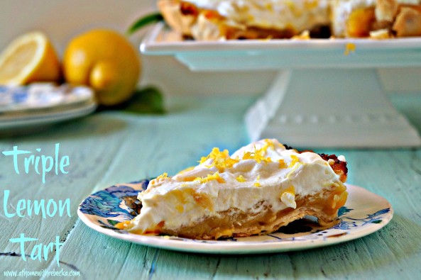 Triple lemon tart is a delicious and easy summer dessert. Layers of tart lemon curd and lemon pudding nestled into a flaky crust, with a topping of freshly whipped cream. 