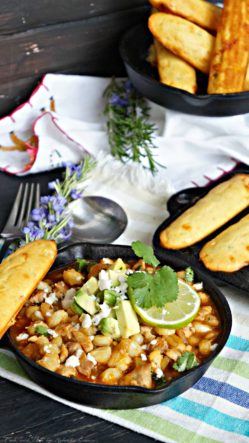 Southwestern Posole Stew with Jalapeño Cheddar Corn Sticks is a hearty and spicy pork stew dinner.